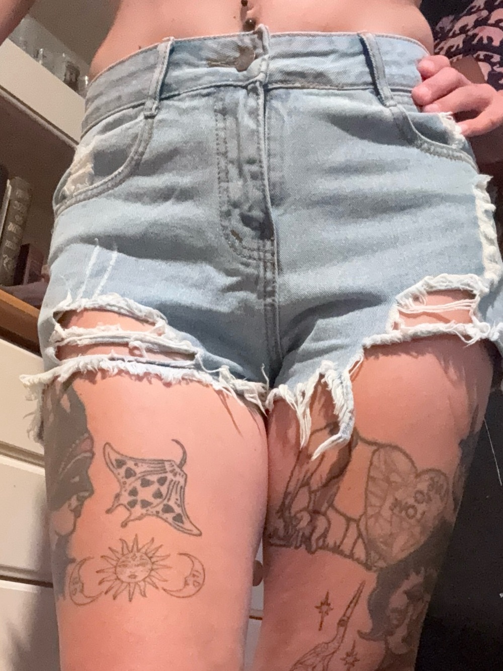 HIGH-RISE DISTRESSED DENIM SHORTS